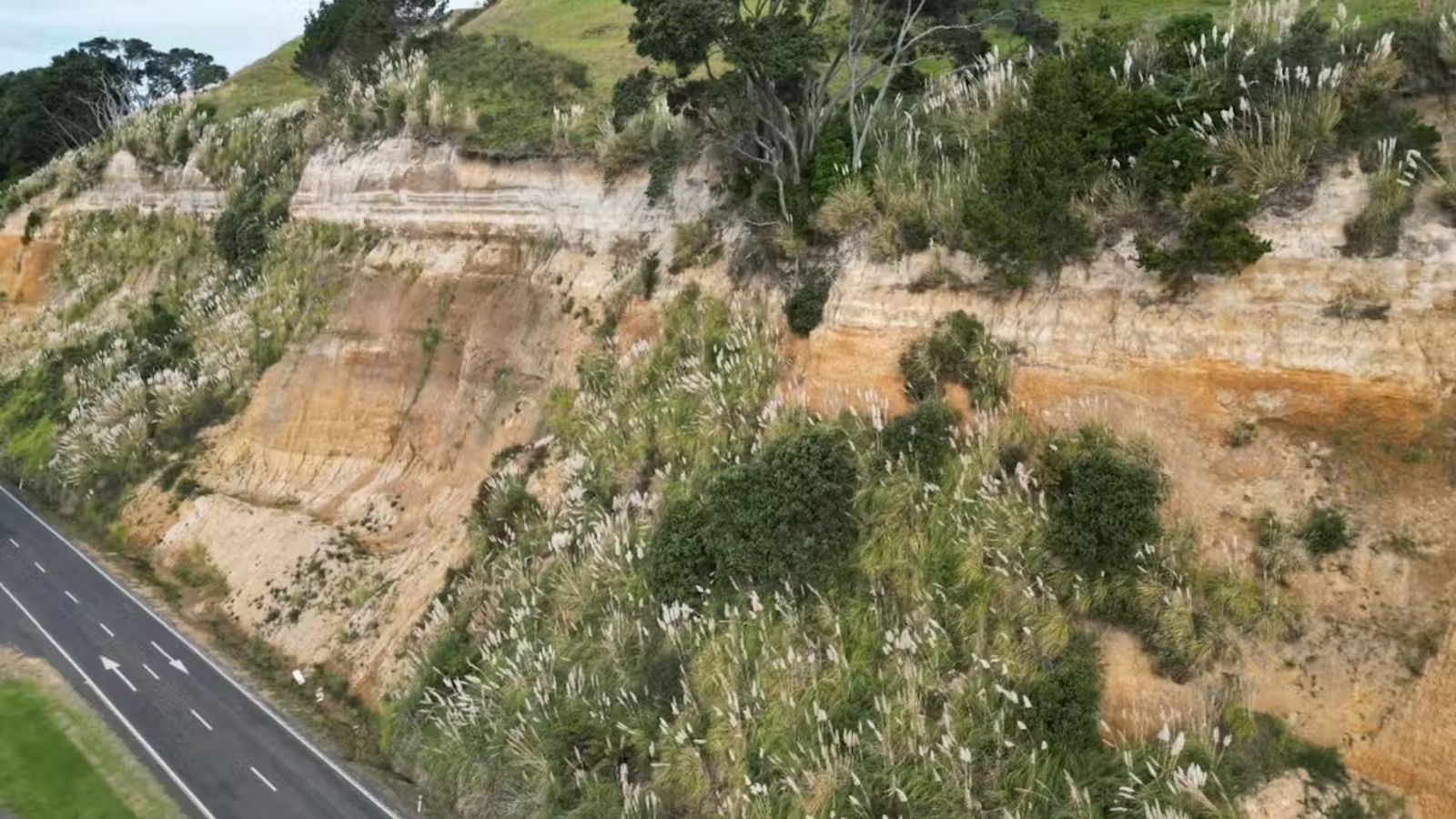 Cliff face showing layers of ashfall deposits 