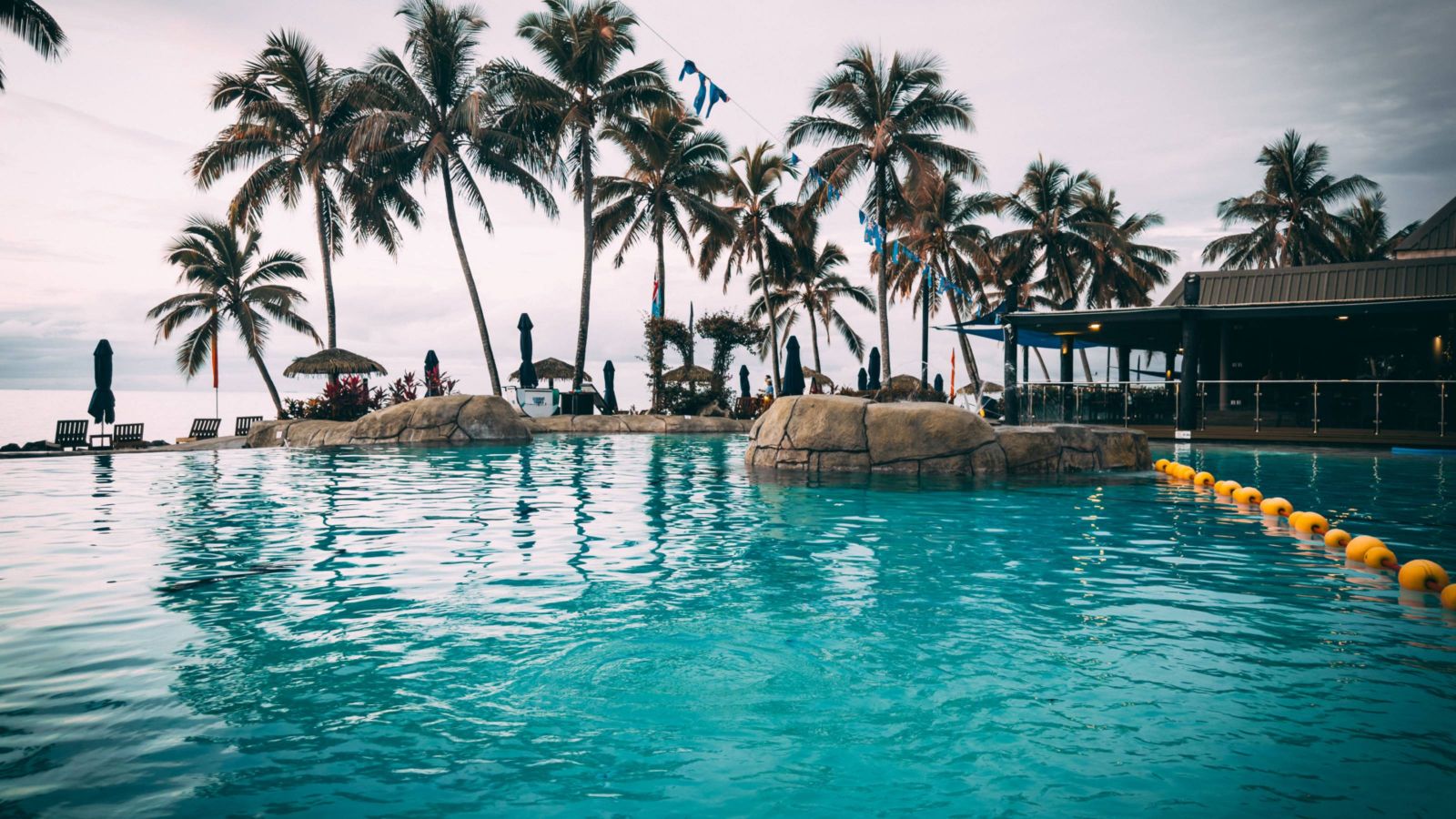 Pool with palm trees in the background at a Fiji resort