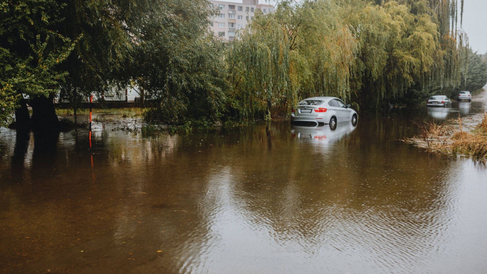 Cars on flooded road 