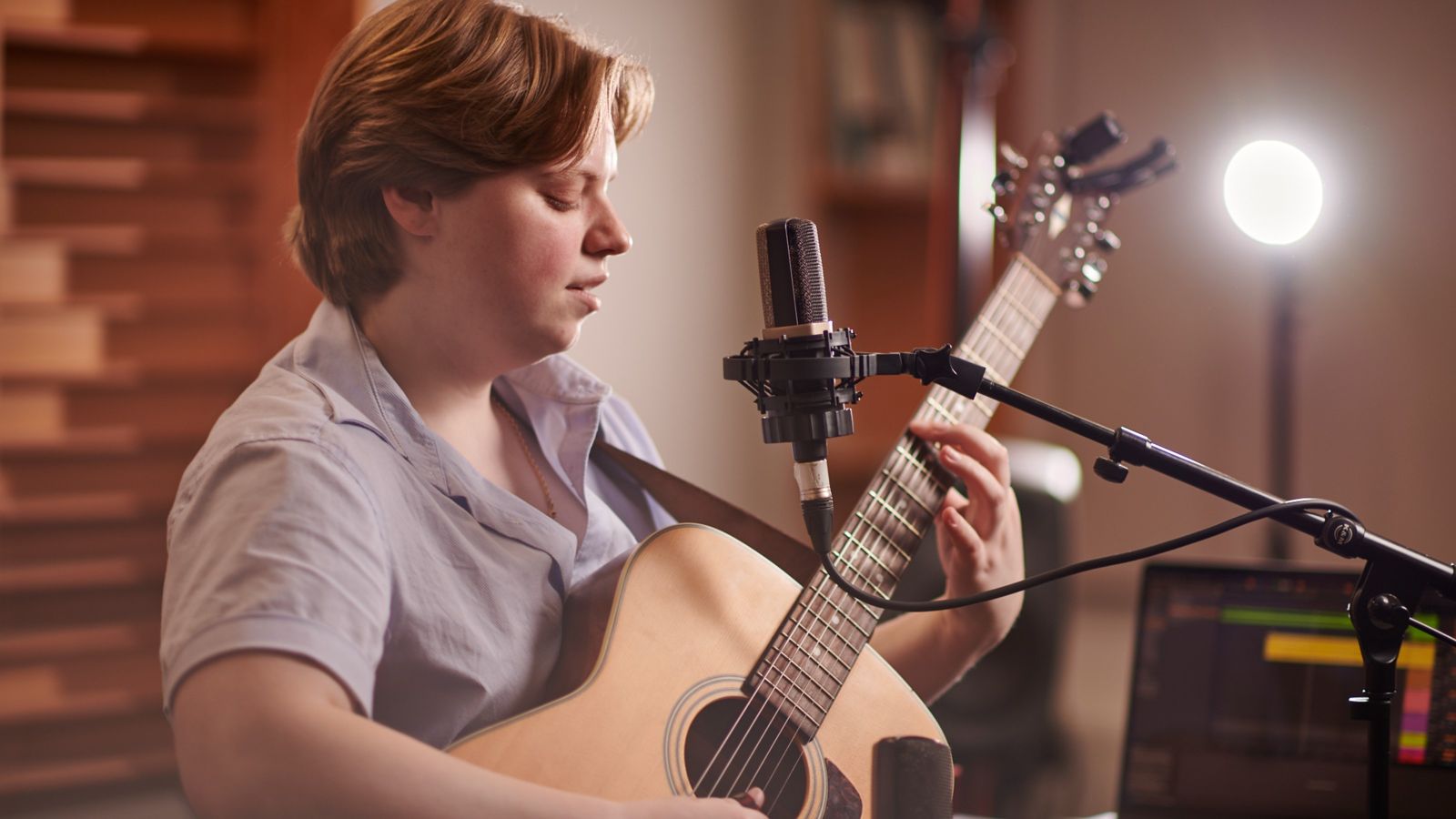 A student playing the guitar.