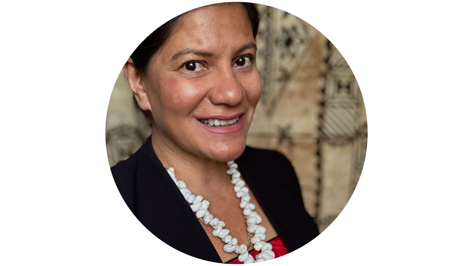 Emma Dunlop-Bennett, Assistant Vice-Chancellor—Pasifika, wearing a dark blazer and a white beaded necklace