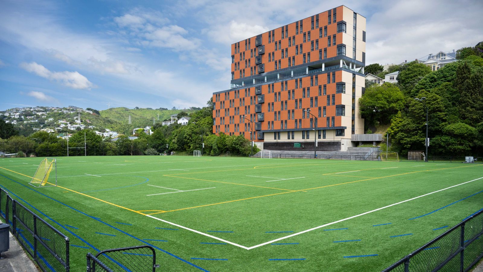 The University Recreation Center in front of a large field.