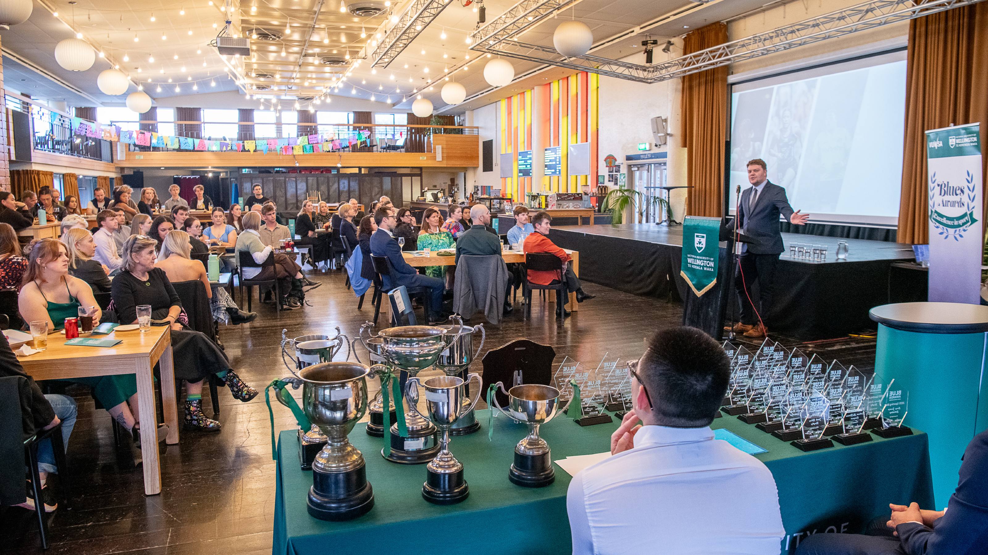 Awards evening with the audience sitting at tables.
