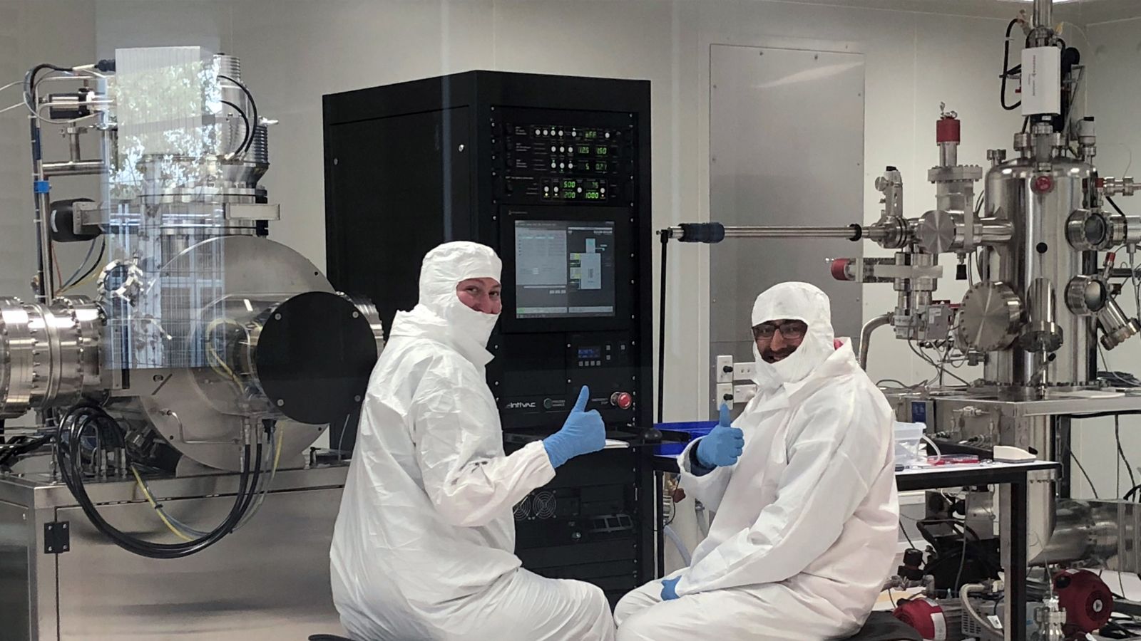Team members pictured with cryogenic equipment