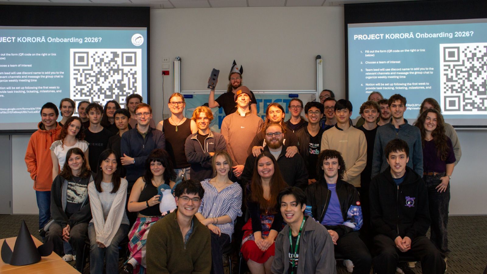 Group photo of 35 students involved in Project Kororā, all smiling to camera.
