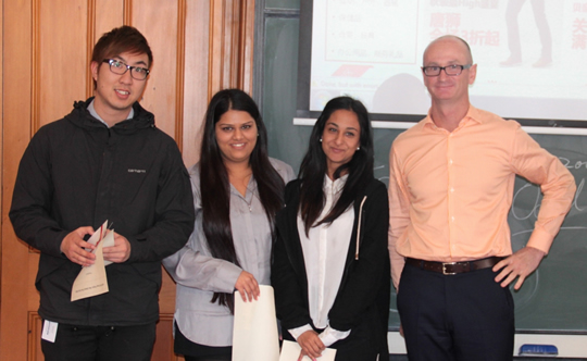 First Prize (left to right): Hoe Kit (Andrew) Chin, Jigna Patel, Atisha Patel, (with Paul Reid) – “Digitized Postal Kiosks”