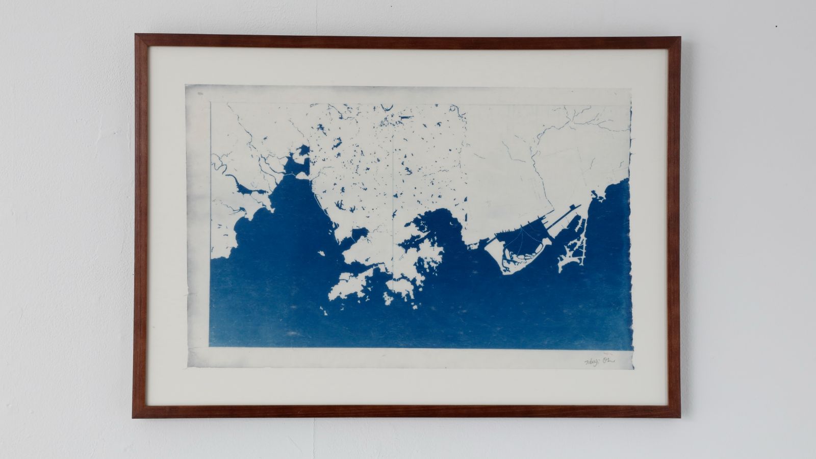 framed photo of blue and white artwork