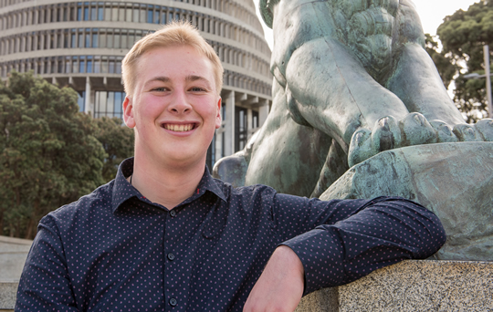BCom student Brad Olsen outside the Parliament Building in Wellington