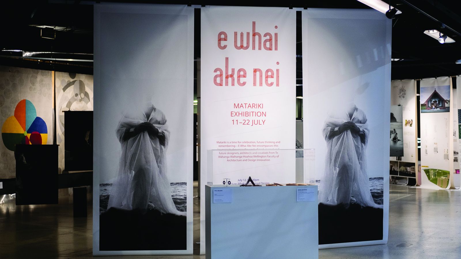 Image of banners with black and white photography and Exhibition banner reading 'E Whai Ake Nei'
