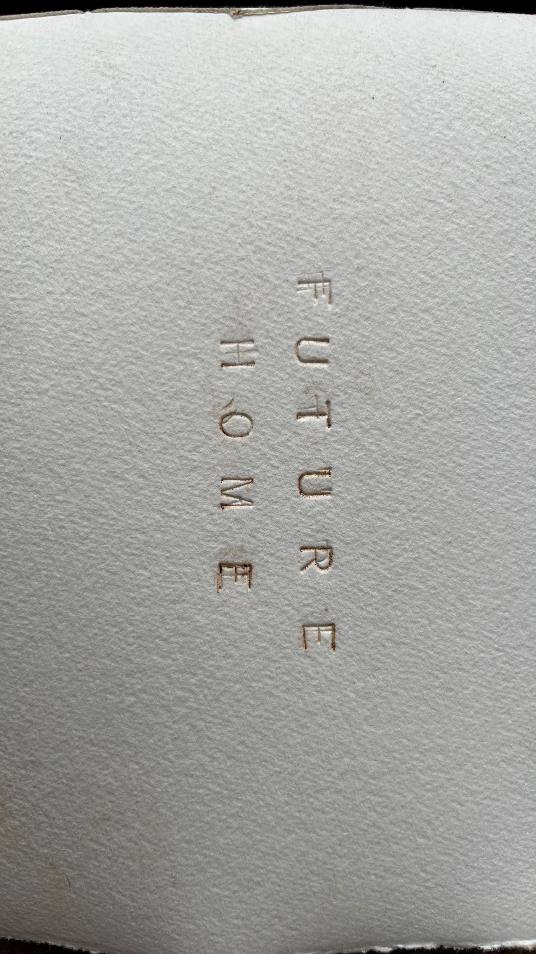 Future Home Exhibition words future home stamped onto white paper
